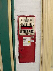 An EVIIR Ludlow wall box at a sub- post office.