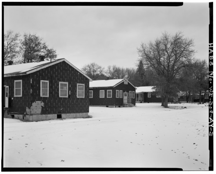 File:GENERAL VIEW, LOOKING NORTHEAST, SHOWING T-1032 IN FOREGROUND ON LEFT. T-1032, T-1031, T-1030 and T-1029 CAN ALSO BE SEEN IN BACKGROUND ON RIGHT. - Fort McCoy, Building No. T HABS WIS,41-SPAR.V,1AY-3.tif