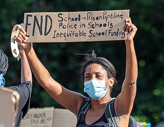 A protester in New York City holding a sign listing some demands George Floyd protest in Grand Army Plaza June 7 (73221).jpg