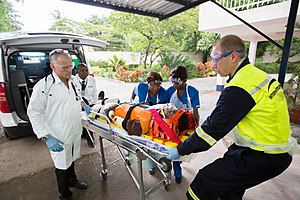 International SOS clinic staff moving a patient into their clinic in Lagos, Nigeria International SOS Clinic Staff moving patient into Clinic.jpg