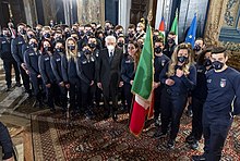 President of Italy Sergio Mattarella delivers the national flag to the Italian Olympic team departing for Beijing 2022. Italy 2022 Winter Olympics Flags Ceremony 05.jpg