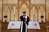 The locution God bless you forms a part of many Christian benedictions, such as in this photograph, where a Lutheran priest offers a benediction at the conclusion of the Divine Service. Lutheran St. Peter and Paul Cathedral Moscow service.jpg