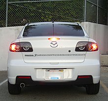 Geeks are often associated with a high appreciation for mathematics. Here, an approximation of the number p (pi) extends from the logo of a Mazda3, parked at University of California, Irvine. Mazda3-pi.jpg