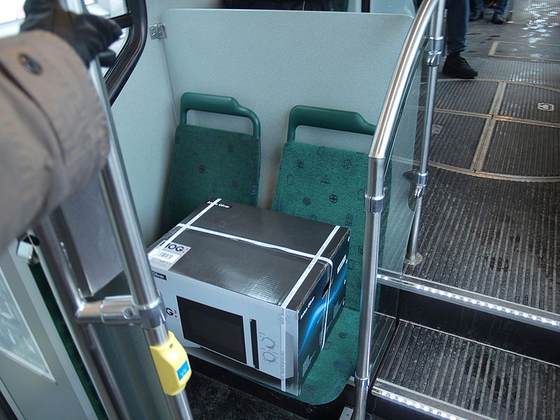 File:Microwave oven taking up two seats on a tram.jpg