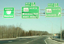 Old mile tabs on I-295 in Rhode Island, several other states did this. As of September 2007
, these signs have been replaced and use only the sequential exit number scheme. Exit numbers on I-295 have since been converted to mile-based numbers. Mile tabs.jpg