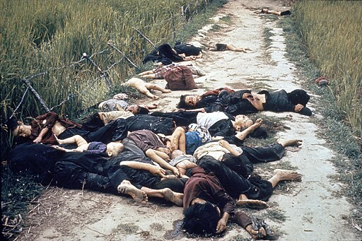  Photo taken by United States Army photographer Ronald L. Haeberle on March 16, 1968 in the aftermath of the My Lai massacre showing mostly women and children dead on a road. Public domain.