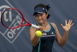 Hibino hitting the forehand.