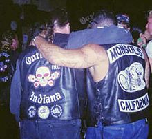 A Mongol with an Outlaws member. Outlaw motorcycle jacket, showing 'colors', Mongols motorcycle jacket, showing colors.jpg