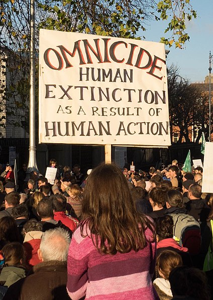 Placard against omnicide, at Extinction Rebellion (2018)