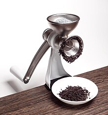 Grinding poppy seeds Poppy seed grinder Jupiter 560, in operation.jpg