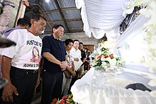 President Rodrigo Duterte (2nd from left) pays his last respects to Joanna Demafelis during the wake at her residence in Iloilo on February 22, 2018. President Rodrigo R. Duterte pays his last respects to the late Overseas Filipino Worker (OFW) Joanna Demafelis as the President visits the wake at her residence in Iloilo on Feb. 22, 2018 (Macky1-3).jpg