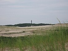 The sand dunes of Provincetown, Massachusetts. The sandy soils did not support agriculture, forcing the former Nauset and people living on offshore islands into greater reliance on sea resources. Provincetown Tower from Sand Dunes, 7.23.2010.jpg