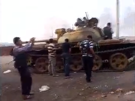 Rebels with captured T-55 at Anadan checkpoint.png