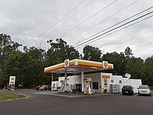 The Reva Market, attached to the post office Reva Market along James Monroe Highway.jpg