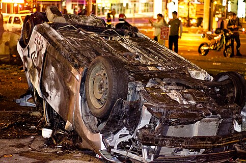 The photograph depicts an car that has been burned and overturned during the en:2011 Vancouver Stanley Cup Riots. This photograph has great encyclopedic value for the Wikipedia page on the riot as it shows the damage. Additionally, the photograph is compelling and well-taken.