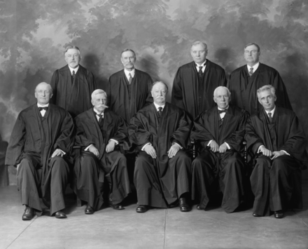 The Taft Court in 1925: Seated in the front row are justices James McReynolds, Oliver Wendell Holmes, William Taft (chief justice), Willis Van Devanter, and Louis Brandeis. Standing in the back row are justices Edward Sanford, George Sutherland, Pierce Butler, and Harlan Stone; Justice Butler, a Catholic, was the lone dissenter to Buck v. Bell in 1927. SUPREME COURT, U.S. TAFT COURT LCCN2016861487 (cropped).png