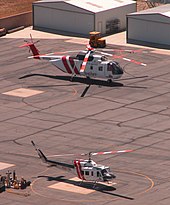 SBC Sheriff's department operates a sizable fleet of helicopters. Shown here are a Bell 212 (foreground) and a Sikorsky S-61 at the air unit's Rialto Airport headquarters.