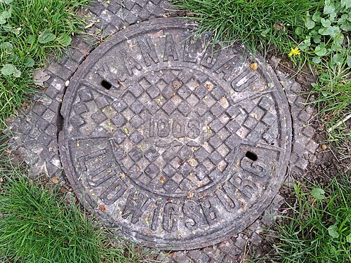 Manhole cover with the inscription Kanalbau Ludwigsburg 1803/1903 in the garden Blühendes Barock in Ludwigsburg