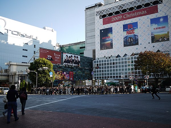A billboard advertising the album Magic in Shibuya Crossing, 2009