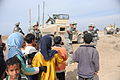 Soldiers Visit Iraqi Kids During Convoy Security Halt DVIDS186959.jpg