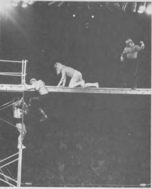 Condrey (far left) during the Midnight Express's scaffold match against the Road Warriors at Starrcade '86 Starrcade 1986 scaffold match between Dennis Condrey & Bobby Eaton and the Road Warriors.png