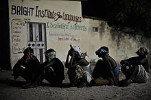 Suspected al-Shabaab militants in Mogadishu during a joint operation between Somali forces and AMISOM, May 2014. Suspected al Shabab militants wait to be taken off for interogation during a joint night operation between the Somali security services and AMISOM forces in Mogadishu, Somalia, on May 4. AU UN IST (14114007504).jpg