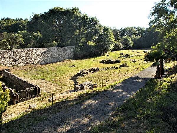 Ruins of the sanctuary of Artemis, including the altar on the left of the picture. The massive altar is precisely rectangular and stood in front of th