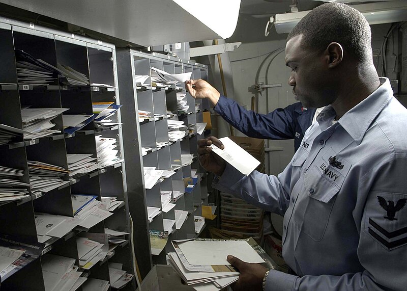 File:US Navy 041027-N-1229B-008 Postal Clerk 2nd Class Owens sorts through the day's mail aboard the Nimitz-class aircraft carrier USS Abraham Lincoln (CVN 72).jpg