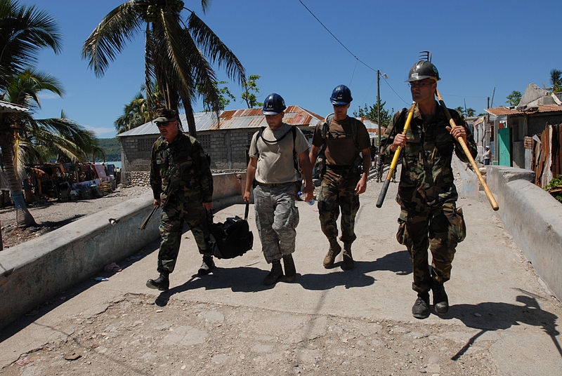 File:US Navy 080924-N-3595W-090 Personnel with Construction Battalion Mobile Unit (CBMU) 202 and Prime Based Engineering Emergency Force arry supplies to rebuild a water pipeline.jpg