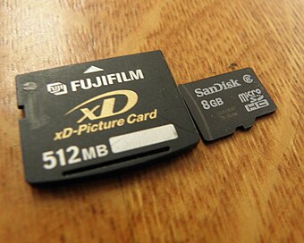 A size comparison of an xD-Picture card with a MicroSD Card
