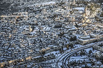 Snow visible on roofs in the Old City of Jerusalem. h`yr h`tyqh byrvSHlym blbn.jpg
