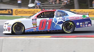 Miller in the JD Motorsports car in 2018 01 Vinnie Miller 2018 Johnsonville 180.jpg