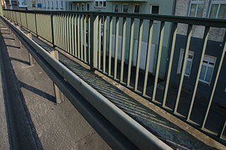 Traffic barrier Barrier installed within medians of and next to roads to prevent vehicle collisions