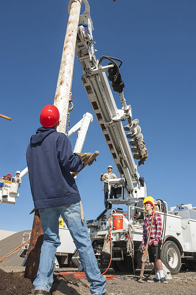 File:2013 Construction Day - Setting a power pole with a boom truck (8777556830).jpg