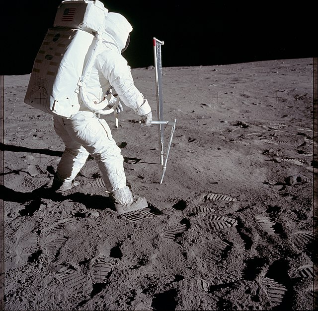 Buzz Aldrin taking a core sample of the Moon during the Apollo 11 mission