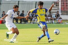 Abhishek Yadav of Mumbai FC and Samir Naik of Dempo SC during a 2008-09 I-League match at the Fatorda Stadium in Goa Abhishek Yadav of Mumbai FC Samir Naik of Dempo SC I-league Goa 13 Feb 2009.jpg