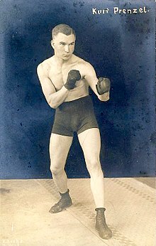 Kurt Prenzel, boxer of the 1920s, displaying orthodox stance with left hand and left foot to the fore Adolf Grohs Boxer Kurt Prenzel Bildseite (cropped).jpg