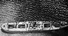 A Japanese Maru sinking. Although the Ships Book USS Biloxi reported that this vessel and an IJN Cruiser was sunk off Okinawa 1945, the Ships History credits two identified vessels sunk by the Biloxi 4 August 1944-the IJN Destroyer "Matsu" and the collier "Ryuko Maru" Aerial view of a Japanese freighter sinking off Okinawa c1945.jpg