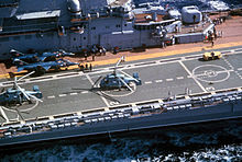 Ka-25 Hormone helicopters and Yakovlev Yak-38  VTOL strike fighters  parked on the flight deck of Minsk in 1986