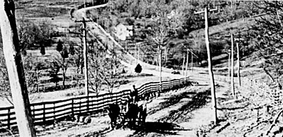 Old Cumberland Road approaching Chestnut Ridge Mountains in Pennsylvania about 1899.