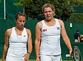 Annika Beck and Anna-Lena Friedsam competing in the third round of the 2015 Wimbledon Qualifying Tournament at the Bank of England Sports Grounds in Roehampton, England. The winners of three rounds of competition qualify for the main draw of Wimbledon the following week.