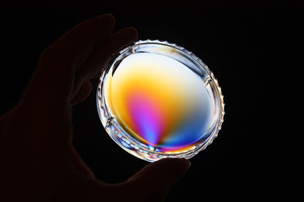 Color pattern of a plastic box showing stress-induced birefringence when placed in between two crossed polarizers.