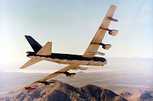 A B-52G in flight. Note the external wing pylons and larger bomb bays to accommodate conventional bombs Boeing B-52G in flight 061026-F-1234S-020.jpg
