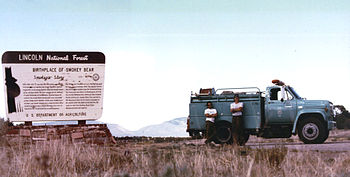 Tahoe National Forest Fire Engine 731 and Crew at Smokey Bear Viewpoint in June 1990 (temporarily assigned to Lincoln National Forest) with the Capitan Mountains and Capitan Gap in the distance. Capitan village is in the valley between the Mountains and the Viewpoint. Capitan gap.jpg