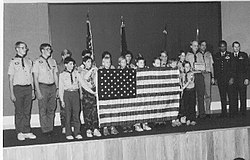 December 18, 1986, the Challenger flag is returned to Troop 514 by astronaut Guion Bluford (second from right) in a formal ceremony at Falcon Air Force Base, Colorado. Challenger Flag.jpg