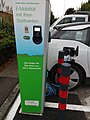 Car charging station (German: "Here you can fill up with green electricity from 100% hydropower")