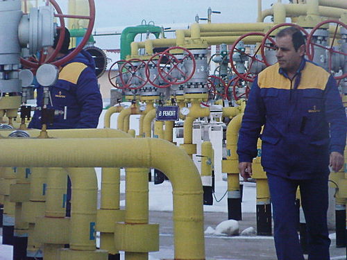 Workers at a natural gas storage depot near Chiren