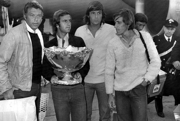 Bertolucci, second from left, with the silver salad bowl in his hands.