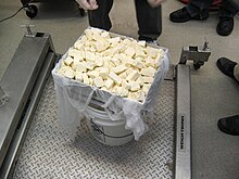 Weighing of cheese curds into moulds Curd Mold.jpg