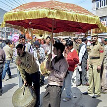 A typical decorated Umbrella held over the deities